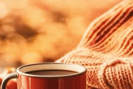 Fluffy orange blanket, a cup of coffee, autumn vibe
