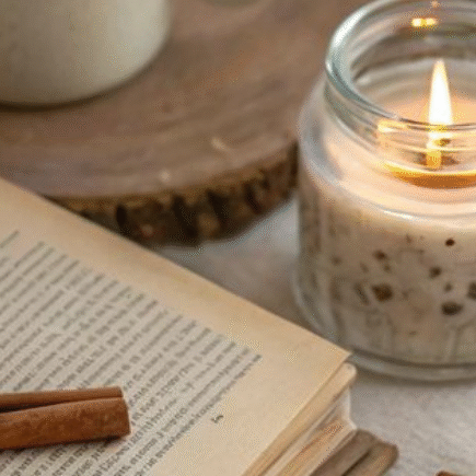 a book, a candle light, a cup of coffee, autumn vibe